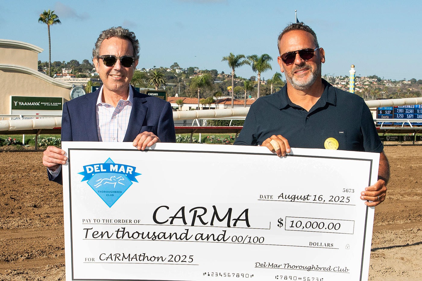 A glimpse of the celebratory atmosphere at CARMAthon 2025, showcasing support from the racing industry and community.