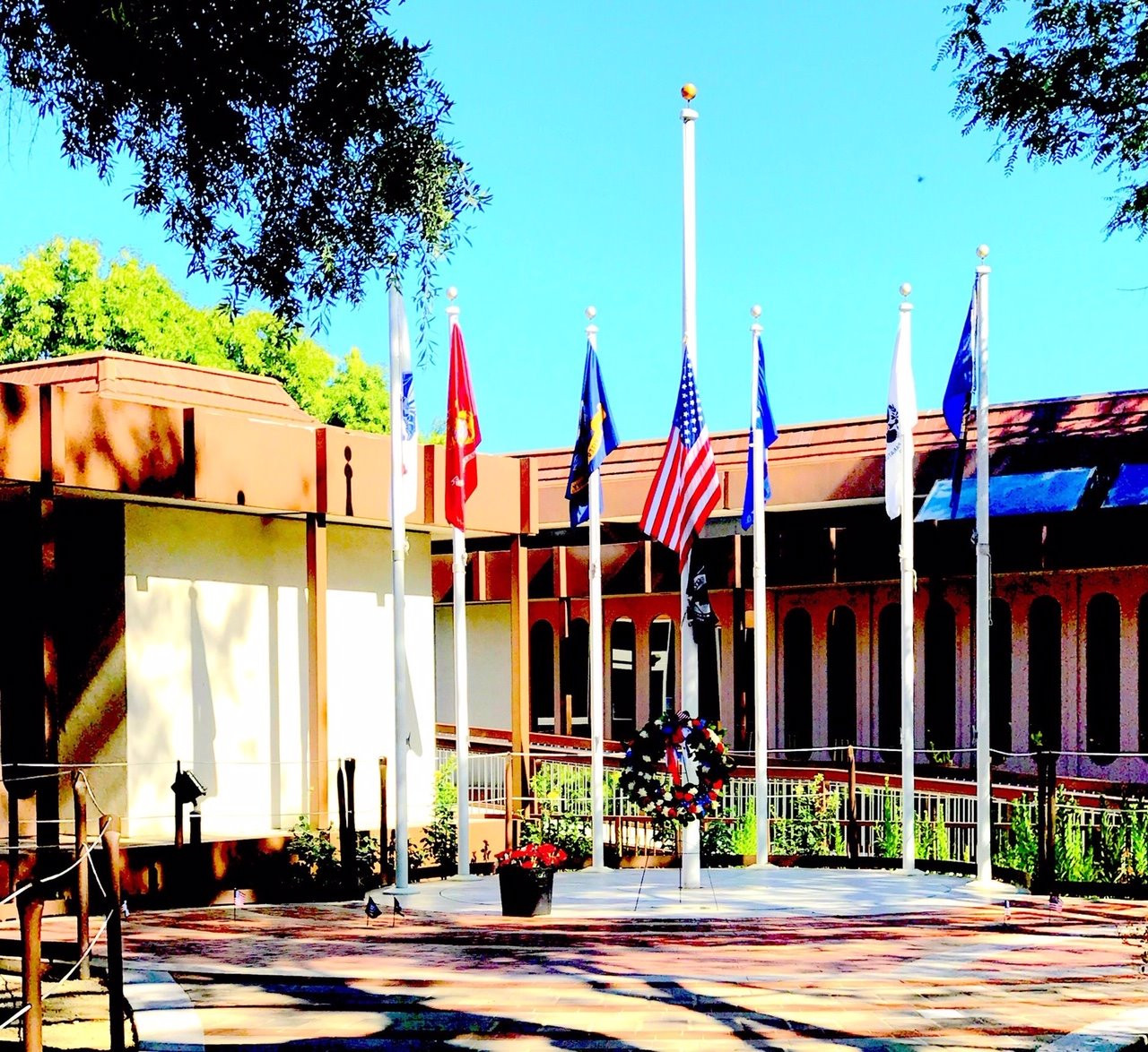 Community gathering at a veterans memorial—Del Mar schools join local events to honor service on Veterans Day.